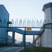 A perimeter fence stands around what is officially known as a vocational skills education center in Dabancheng, in China's Xinjiang Uyghur Autonomous Region, in 2018. | REUTERS